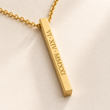 Close detail of the gold medium column necklace