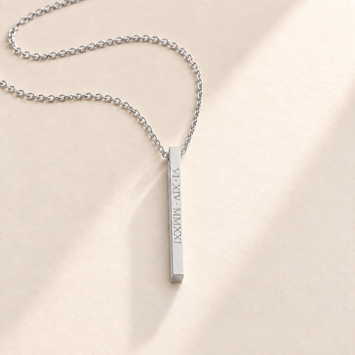 Custom medium column necklace in silver on pale cream