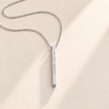 Custom medium column necklace in silver on pale cream