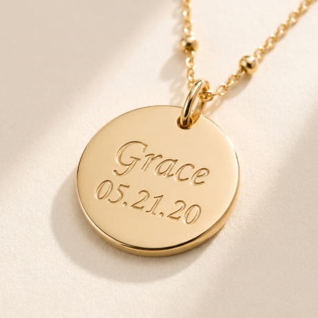 Custom Memorial Bracelet detail photo - close-up of engraved name and date on gold disc Anthology Jewelry