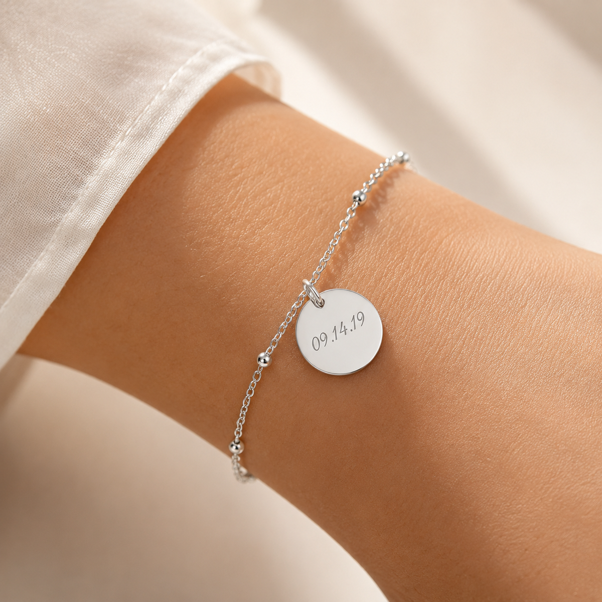 Custom Memorial Bracelet detail photo - alternate angle of engraved name and date disc Anthology Jewelry