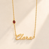 Gold script Clara necklace with january birthstone-color stone on left chain