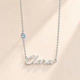 Custom Offset Birthstone Script Name Necklace march silver birthstone photo - Clara script with oval left-chain stone Anthology Jewelry