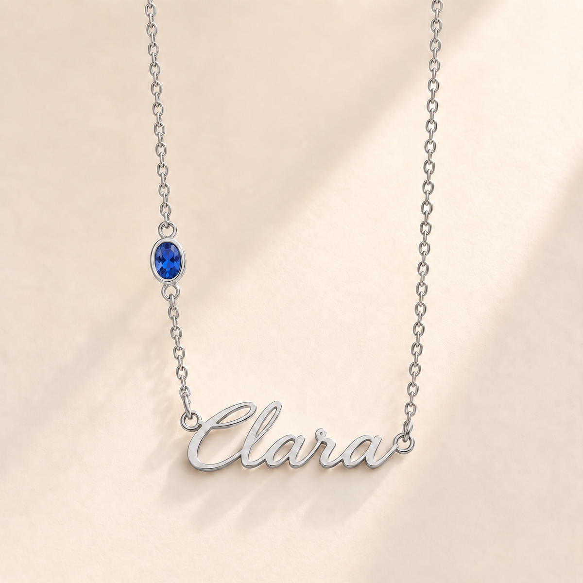 Custom Offset Birthstone Script Name Necklace september silver birthstone photo - Clara script with oval left-chain stone Anthology Jewelry