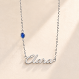Custom Offset Birthstone Script Name Necklace september silver birthstone photo - Clara script with oval left-chain stone Anthology Jewelry
