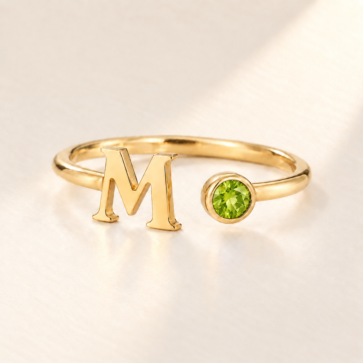 Custom Open Birthstone Initial Ring, gold august birthstone variant image; ivory background