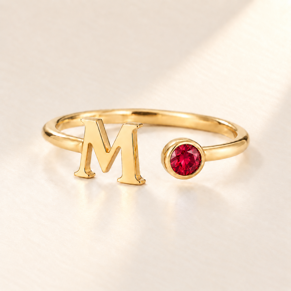 Custom Open Birthstone Initial Ring, gold july birthstone variant image; ivory background