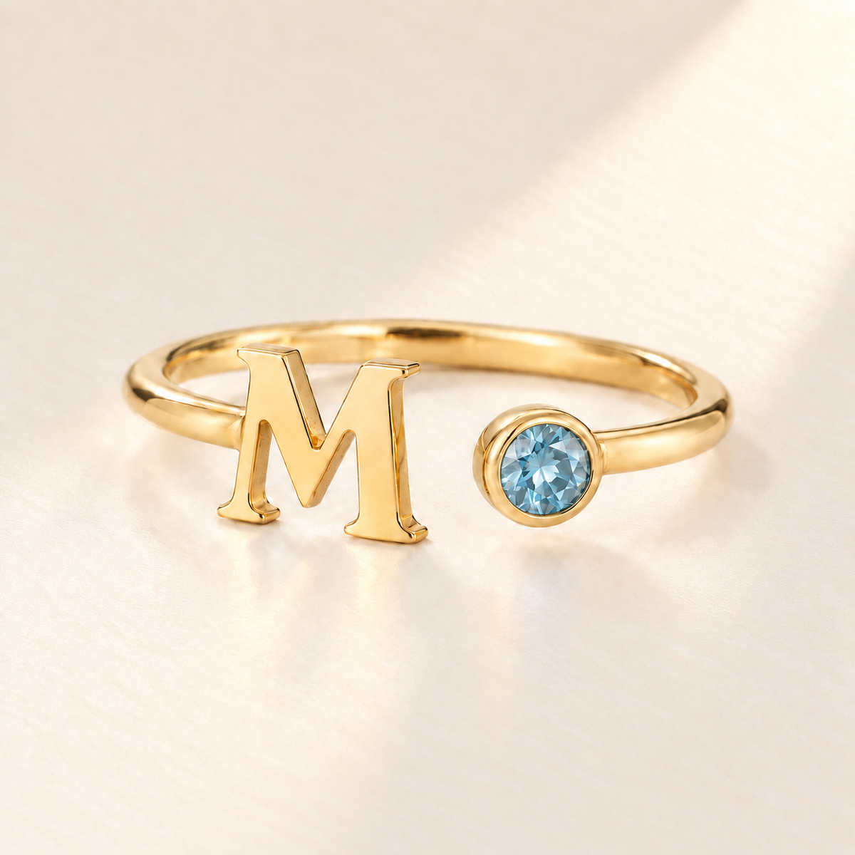Custom Open Birthstone Initial Ring, gold march birthstone variant image; ivory background
