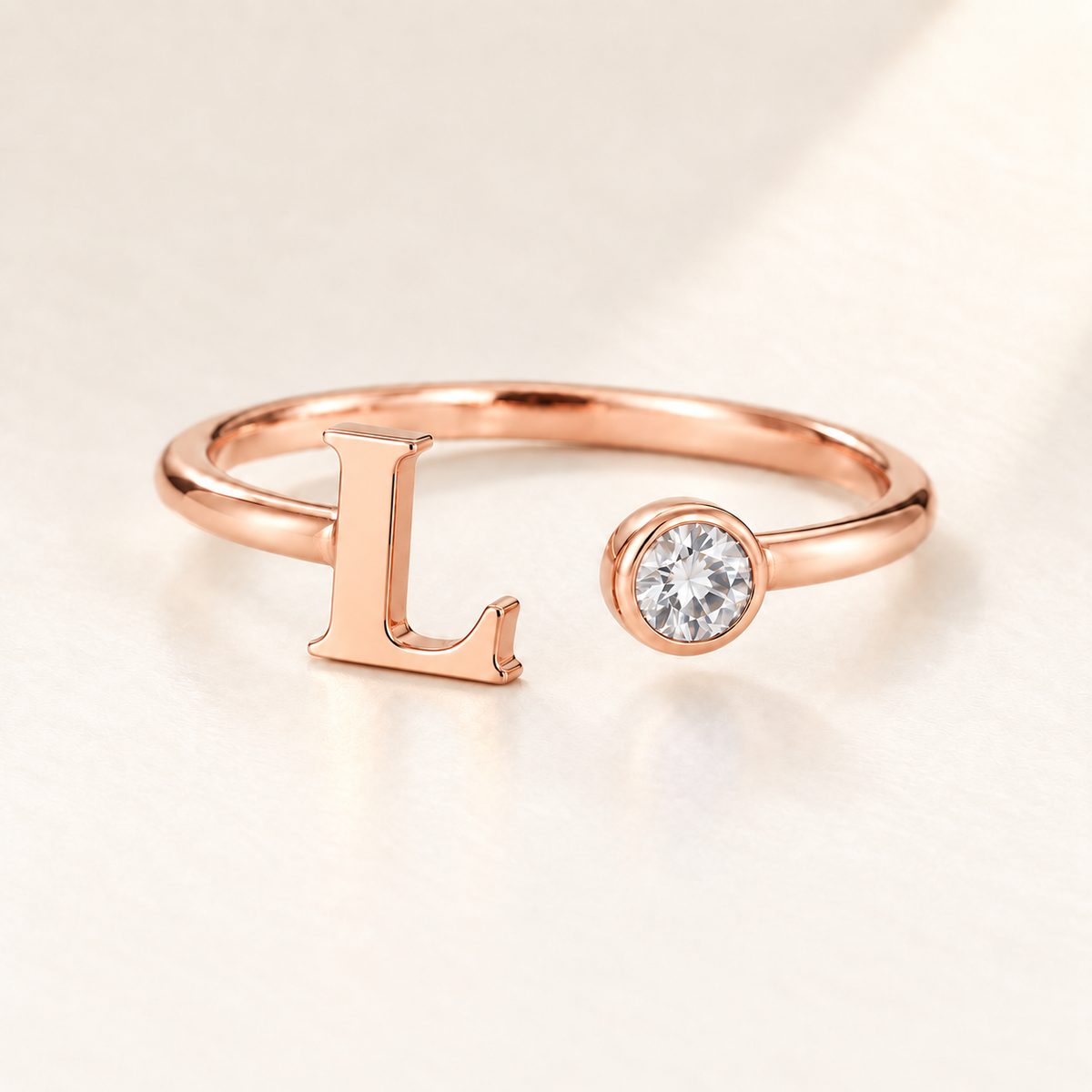 Custom Open Birthstone Initial Ring, rose gold april birthstone variant image; ivory background