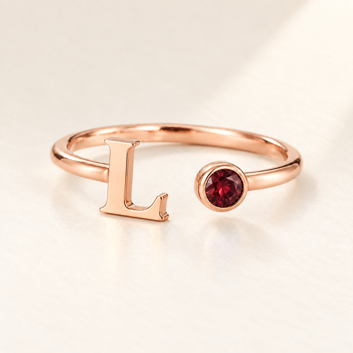 Custom Open Birthstone Initial Ring, rose-gold-january birthstone variant image; ivory background