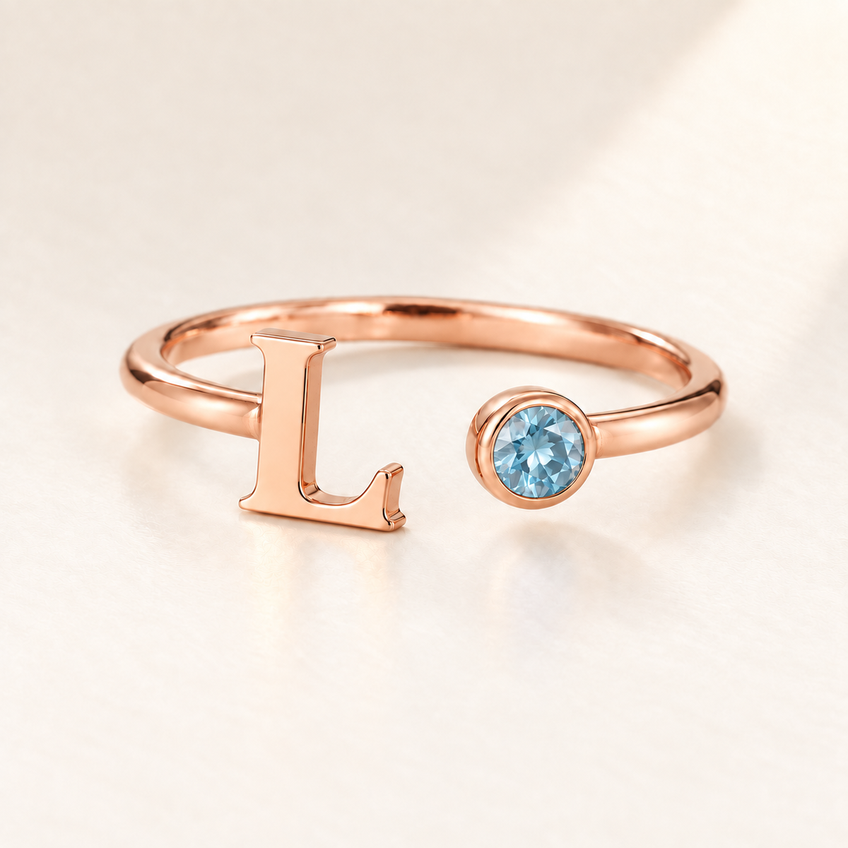 Custom Open Birthstone Initial Ring, rose gold march birthstone variant image; ivory background