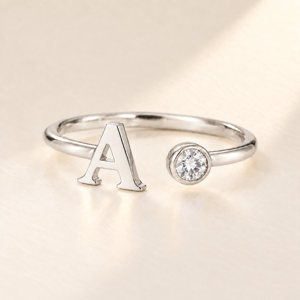 Custom Open Birthstone Initial Ring, silver april birthstone variant image; ivory background