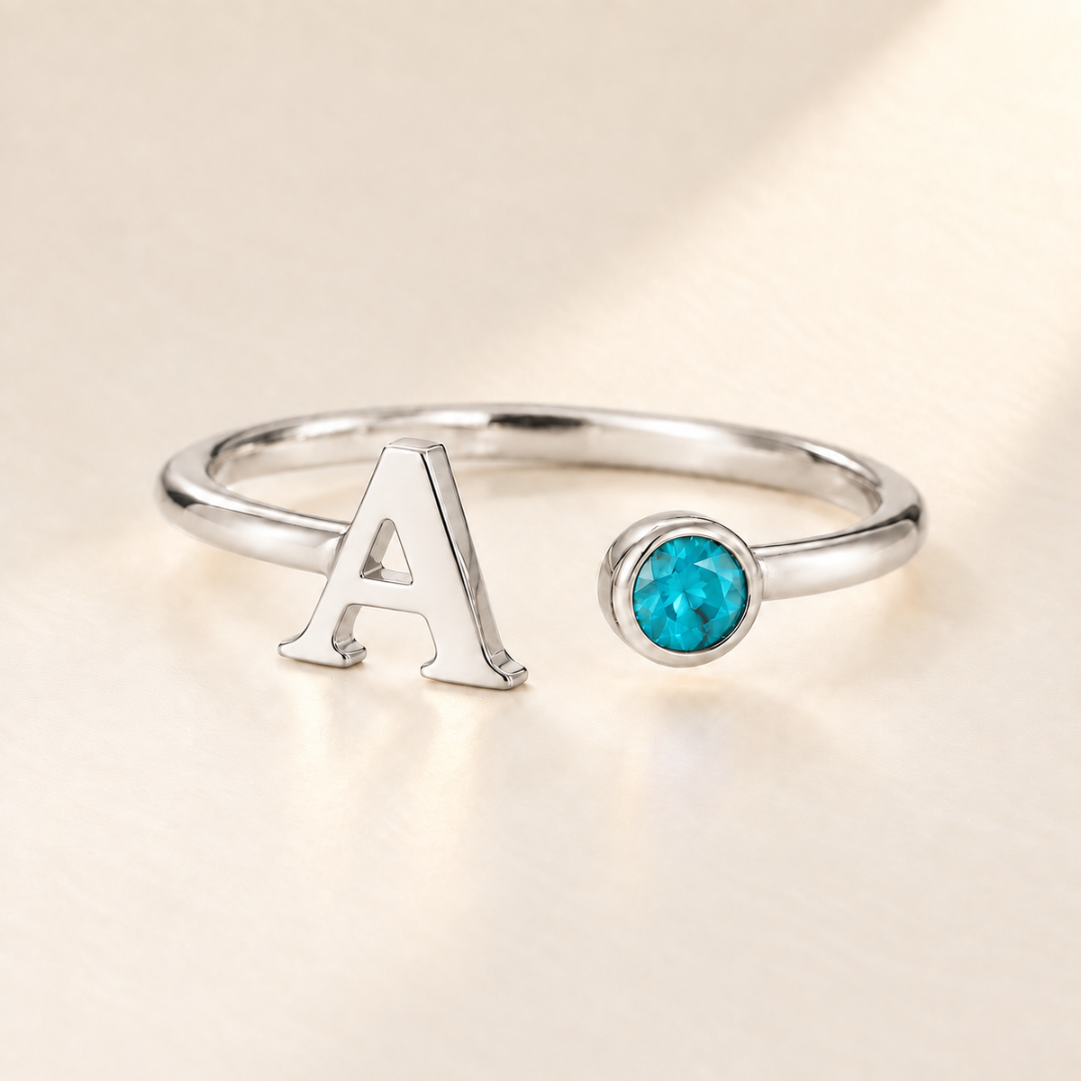 Custom Open Birthstone Initial Ring, silver december birthstone variant image; ivory background
