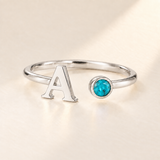 Custom Open Birthstone Initial Ring, silver december birthstone variant image; ivory background