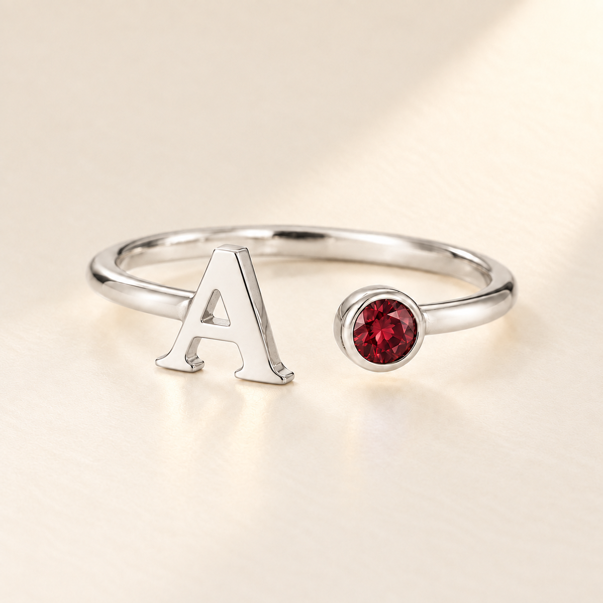 Custom Open Birthstone Initial Ring, silver-january birthstone variant image; ivory background