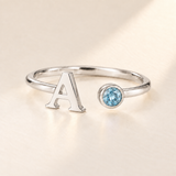 Custom Open Birthstone Initial Ring, silver march birthstone variant image; ivory background