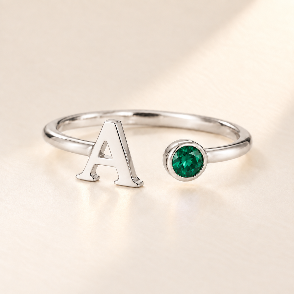 Custom Open Birthstone Initial Ring, silver may birthstone variant image; ivory background