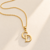 Custom Overlapping Initials Necklace hero photo - gold C and D serif initials pendant on a fine cable chain Anthology Jewelry