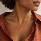 Custom Overlapping Initials Necklace lifestyle photo - gold C and D pendant worn with a rust linen shirt Anthology Jewelry