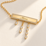 Custom Pavé Nameplate Drop Necklace macro detail of engraved Mara bar and 1, 2 and 4 marquise drops photo - Anthology Jewelry