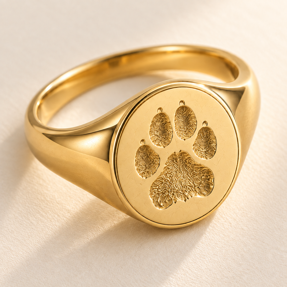 Macro detail of engraved paw print signet ring