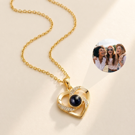 Custom Photo Necklace Swirl Heart Pendant hero photo - gold swirl heart pendant with photo projection stone on cream background Anthology Jewelry