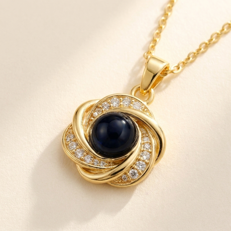 Custom Photo Necklace Swirl Knot Pendant detail photo - close-up of love-knot loops and photo projection stone Anthology Jewelry