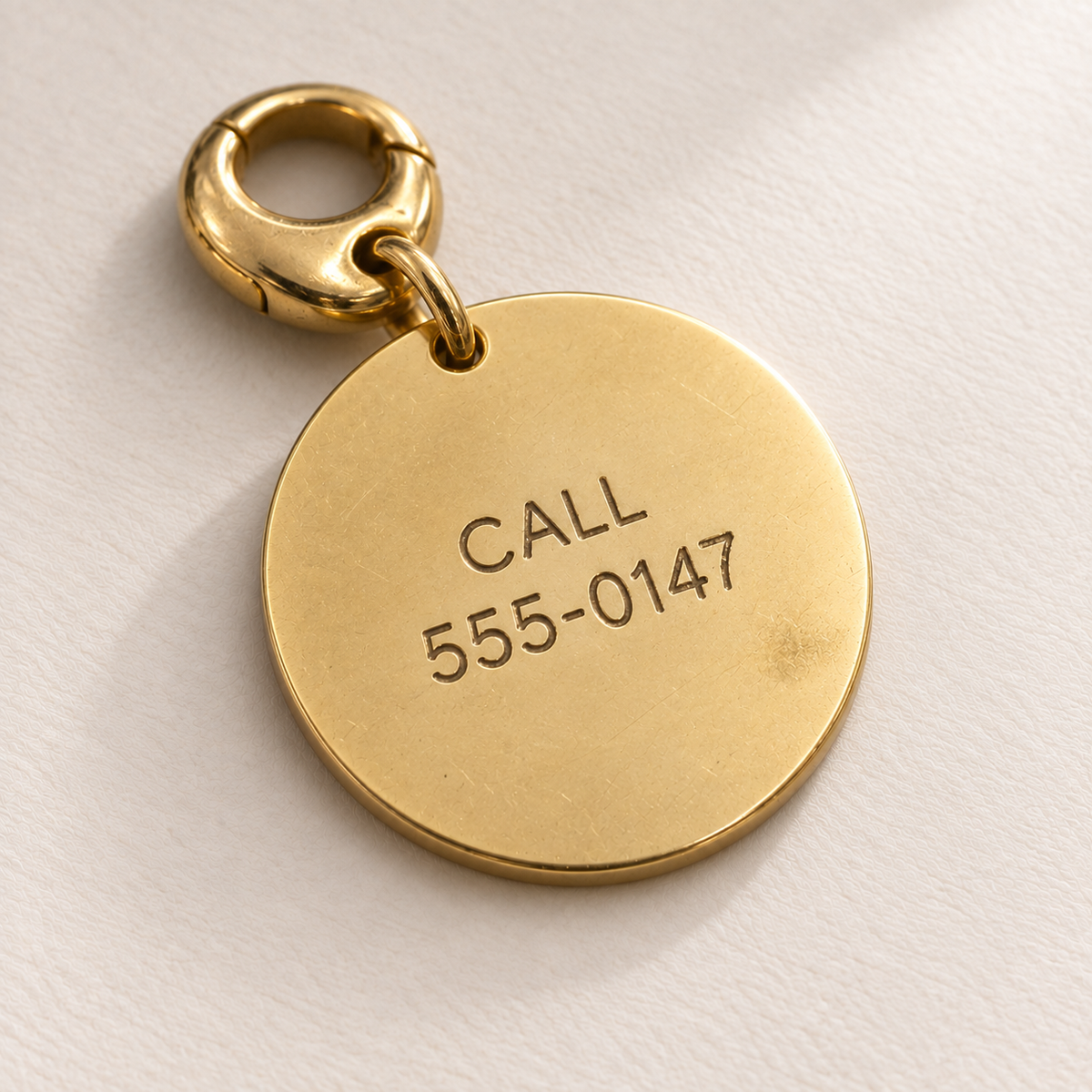 Custom Portrait Pet Tag back detail photo - contact engraving on gold tag Anthology Jewelry