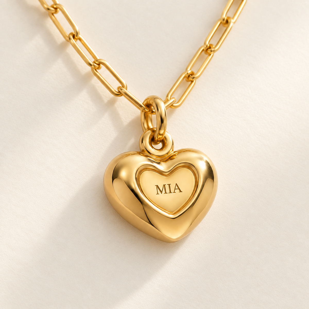 Custom Puffy Heart Necklace detail photo - macro of the small engraved heart inside the rounded heart pendant Anthology Jewelry