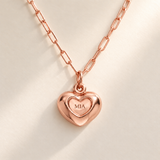 Custom Puffy Heart Necklace hero photo - rose gold heart with MIA engraving and soft consistent diagonal light Anthology Jewelry