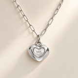 Custom Puffy Heart Necklace hero photo - silver heart with MIA engraving and soft consistent diagonal light Anthology Jewelry