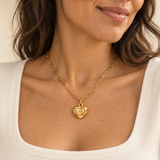 Custom Puffy Heart Necklace lifestyle photo - rounded heart pendant on an open-link chain worn at the neckline Anthology Jewelry