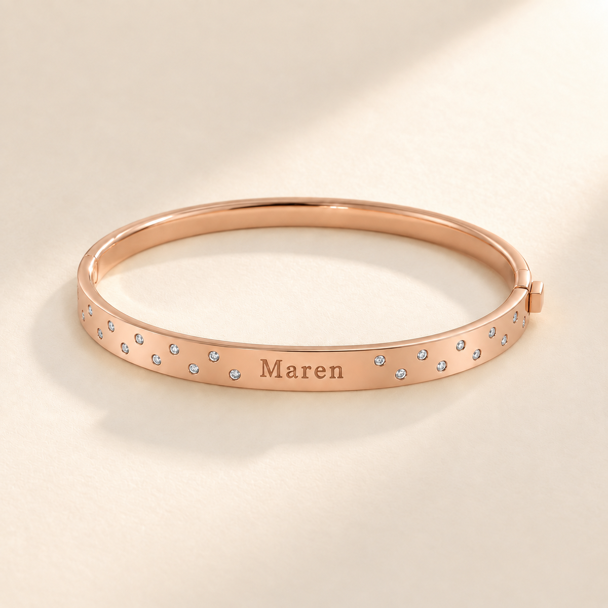 Rose-gold scattered-stone name bangle with Maren engraving