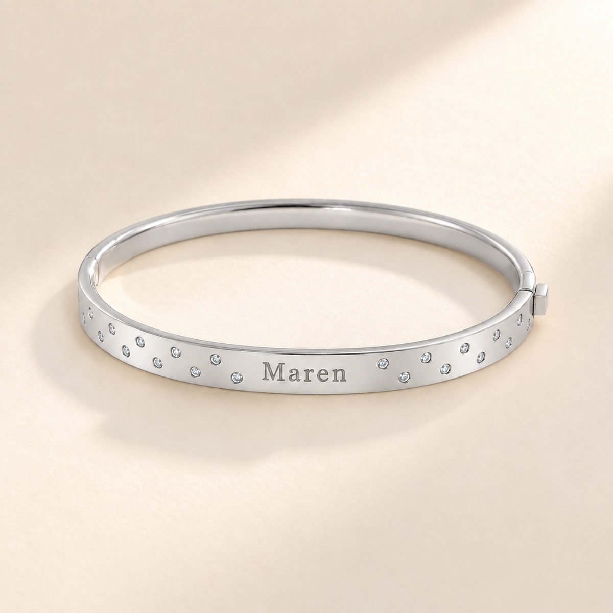 Silver scattered-stone name bangle with Maren engraving