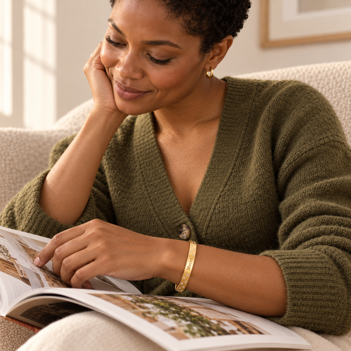Maren name bangle worn while reading indoors