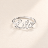 Custom Script Name Ring hero photo - silver ring with a cutout cursive name across the front Anthology Jewelry
