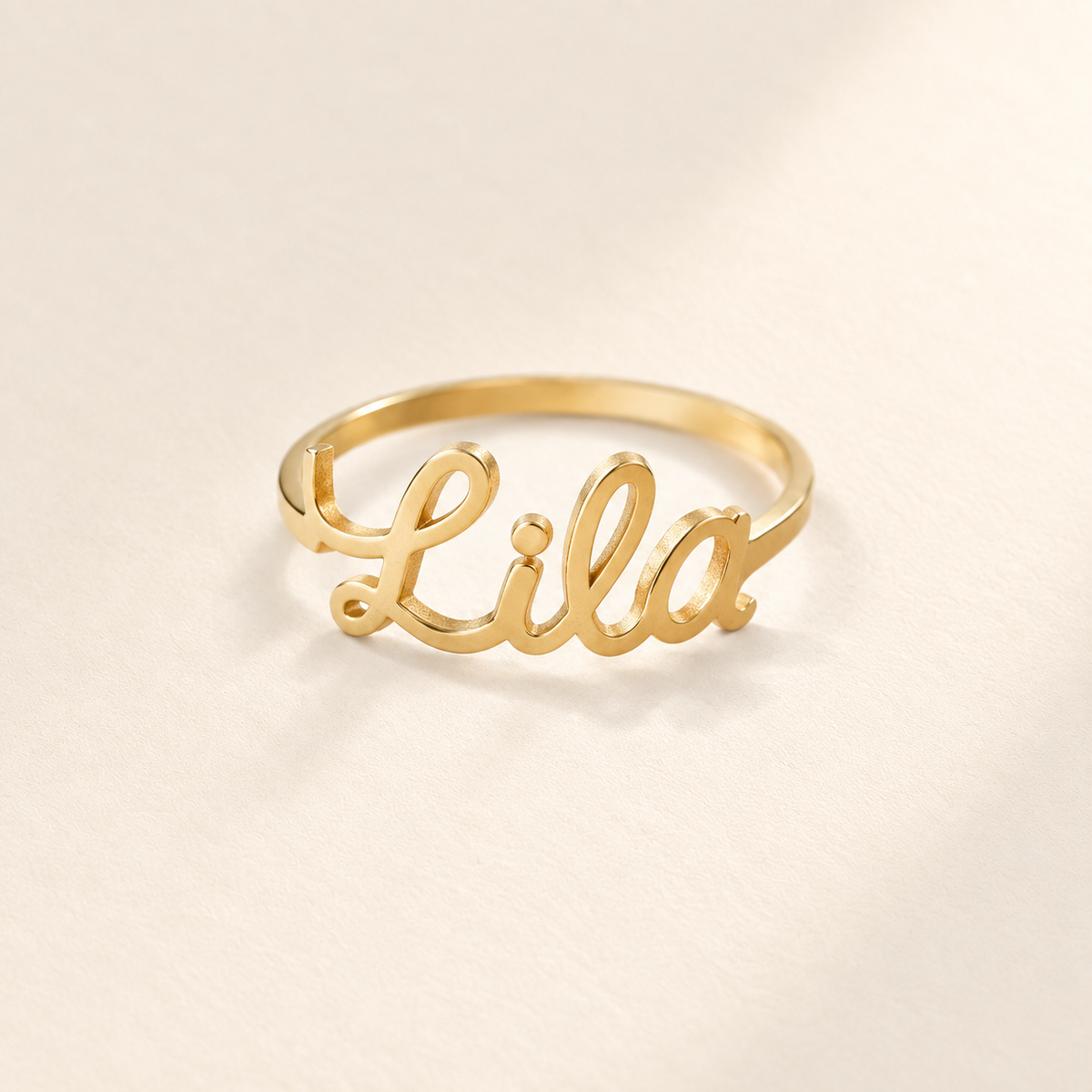 Custom Script Name Ring hero photo - gold ring with Lila name sculpted across the front Anthology Jewelry