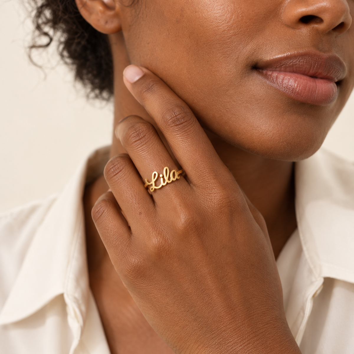 Custom Script Name Ring lifestyle photo - gold cutout script name ring worn on the hand Anthology Jewelry