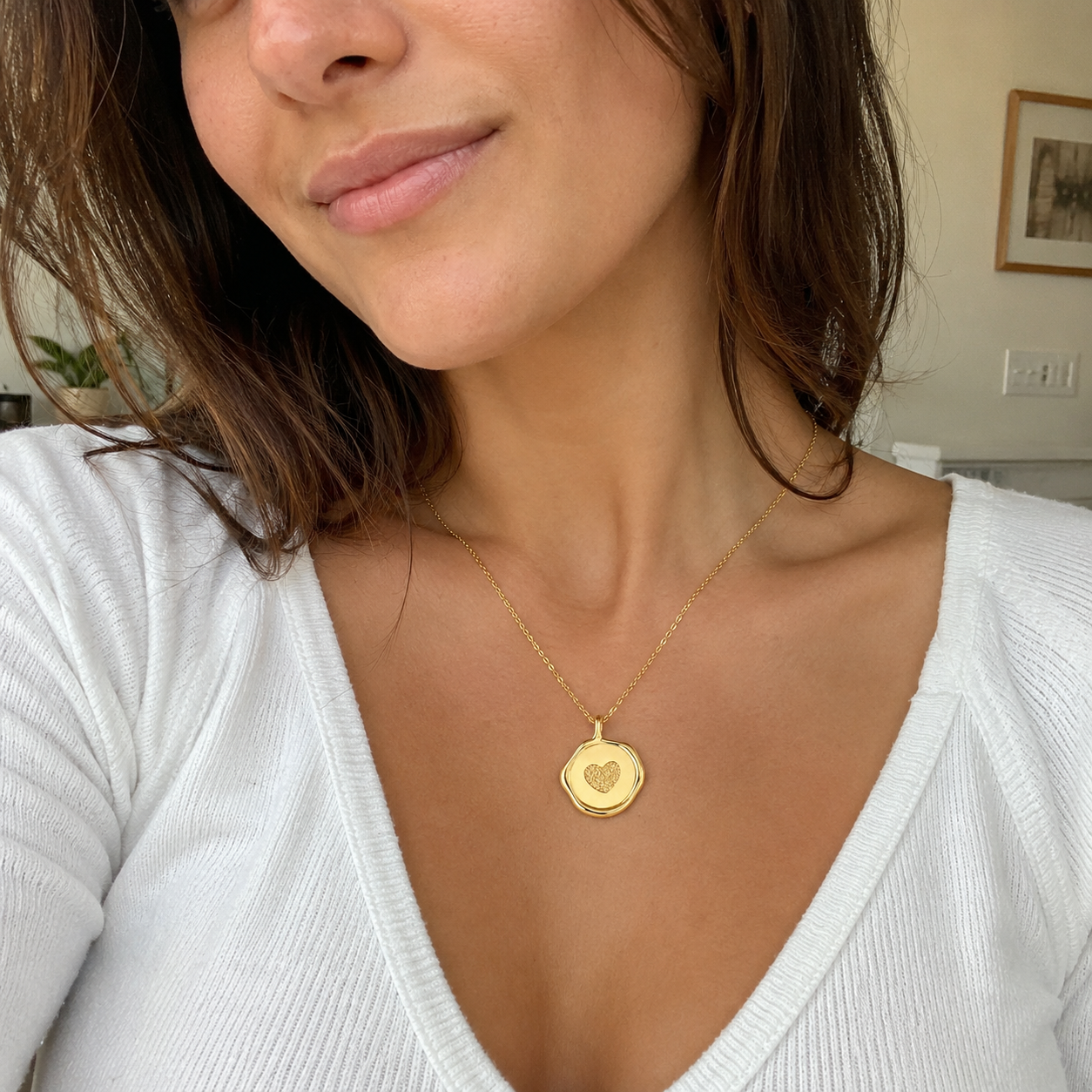 Custom stamp necklace gold fingerprint heart engraving worn selfie - Anthology Jewelry Company