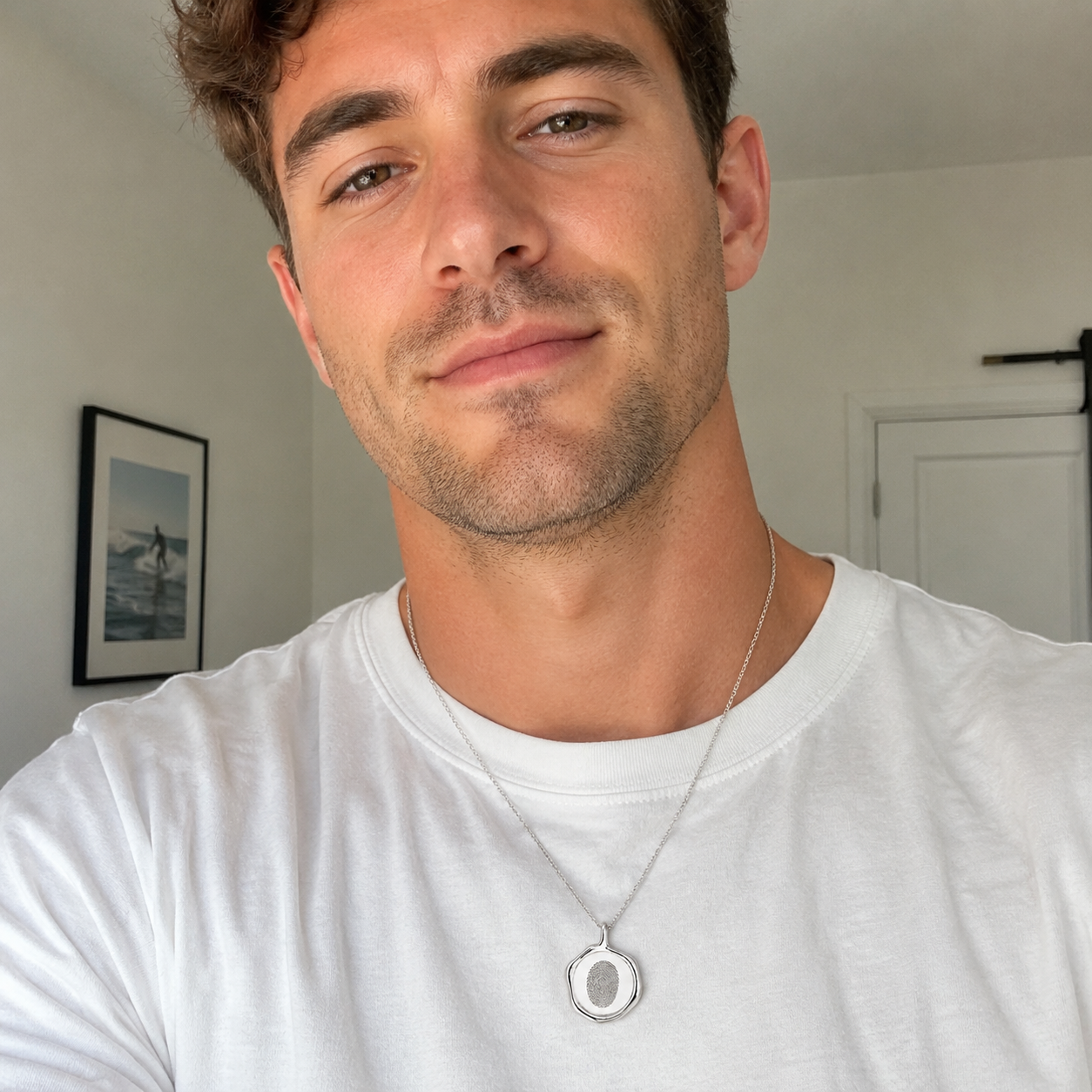 Custom stamp necklace silver fingerprint engraving worn by male model - Anthology Jewelry Company