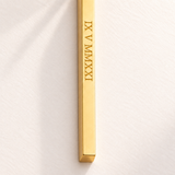 Custom Thin Column Necklace detail photo - close view of Roman numeral date engraved on gold column Anthology Jewelry