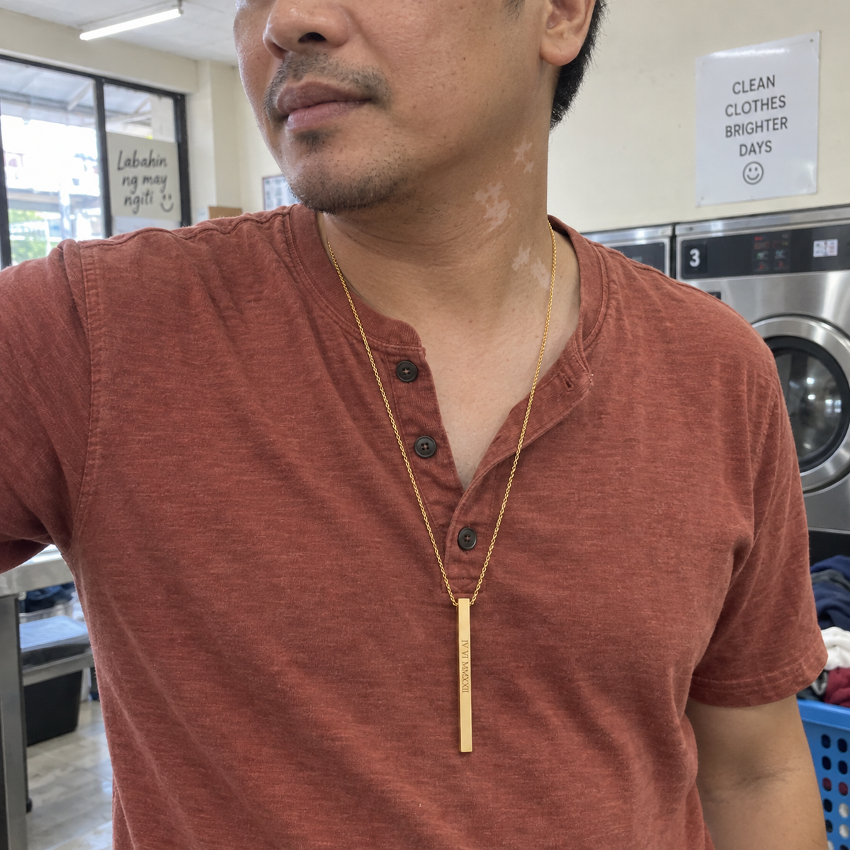 Custom Thin Column Necklace customer photo - man in a laundromat wearing gold column necklace Anthology Jewelry