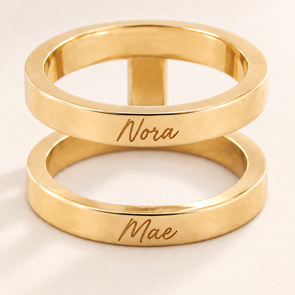 Custom Thin Double Ring detail photo - close view of handwritten names on thin gold bands Anthology Jewelry