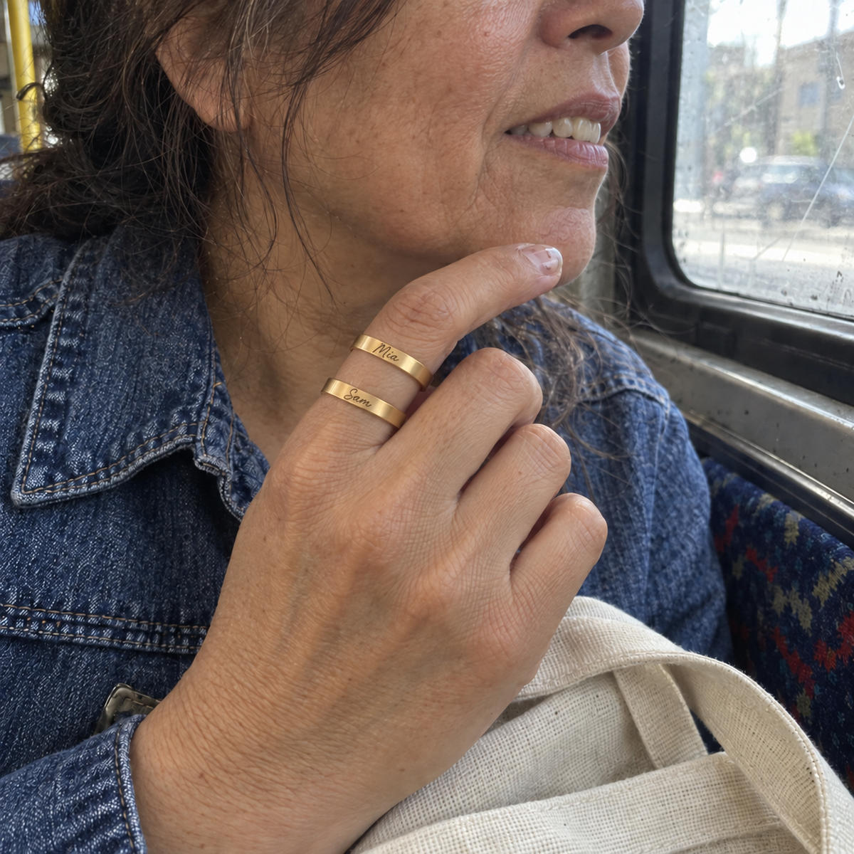 Custom Thin Double Ring customer photo - woman on a bus wearing gold double band ring Anthology Jewelry