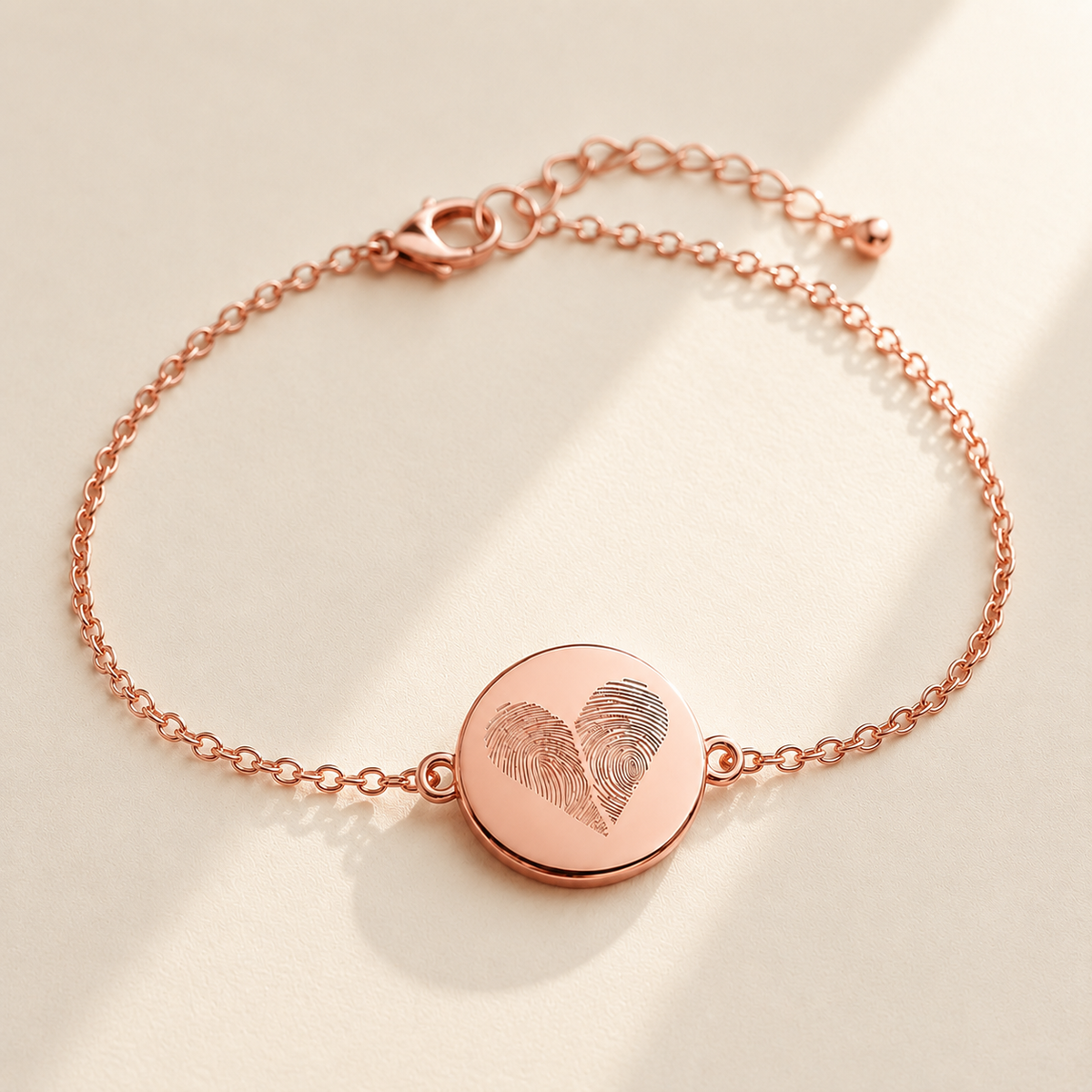 Custom Two Fingerprint Heart Bracelet hero photo - rose gold engraved disc bracelet on cream background Anthology Jewelry