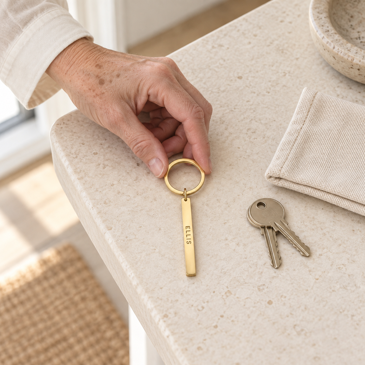 Older woman reaching for keys with a custom vertical bar keychain