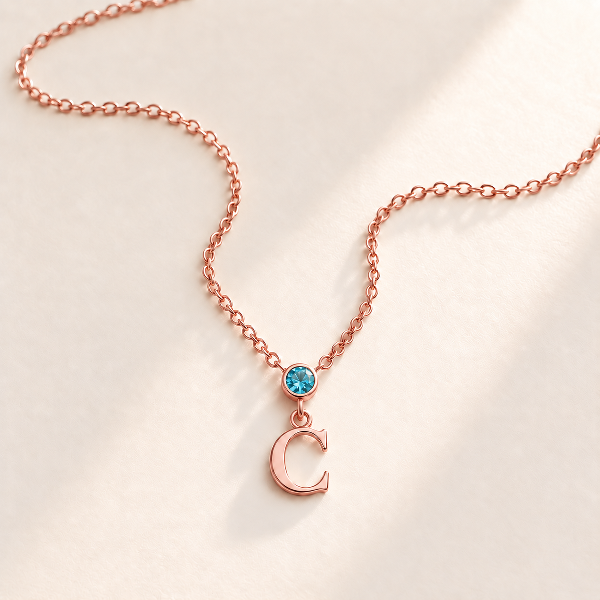 Custom Vertical Birthstone Initial Necklace december rose gold birthstone photo - round inline stone with hanging serif C Anthology Jewelry