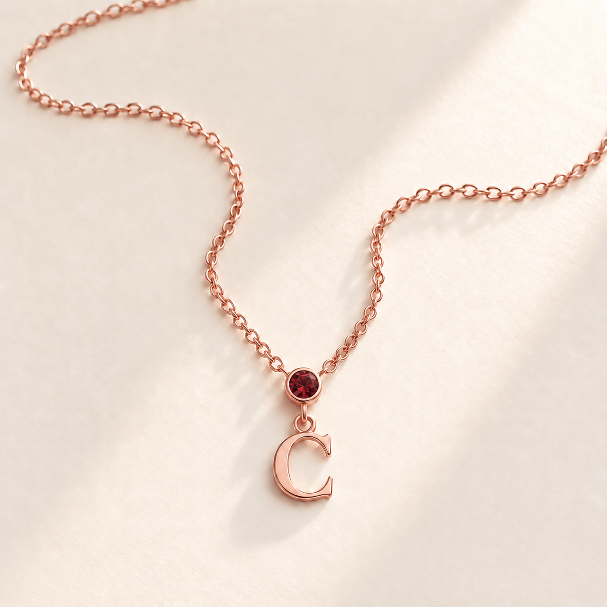 Custom Vertical Birthstone Initial Necklace january rose gold birthstone photo - round inline stone with hanging serif C Anthology Jewelry