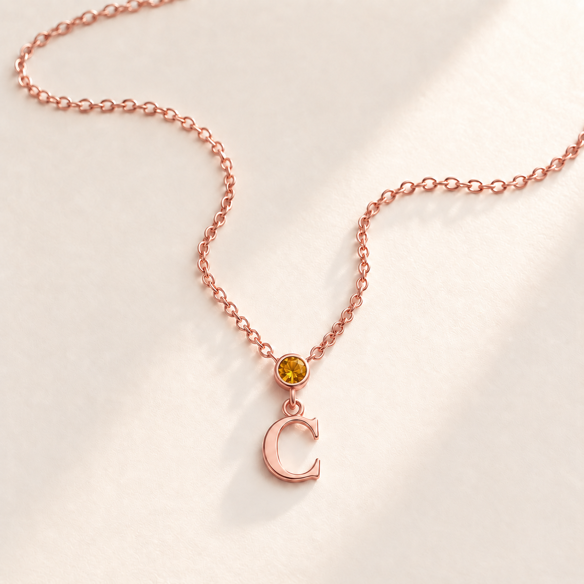 Custom Vertical Birthstone Initial Necklace november rose gold birthstone photo - round inline stone with hanging serif C Anthology Jewelry