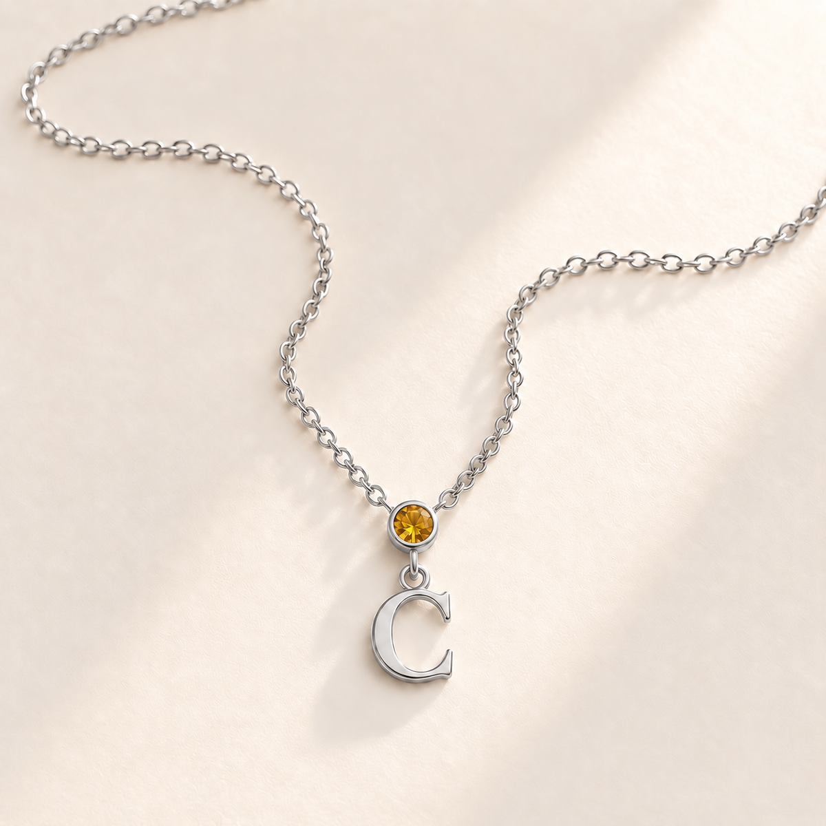 Custom Vertical Birthstone Initial Necklace november silver birthstone photo - round inline stone with hanging serif C Anthology Jewelry